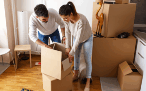 Couple opening moving boxes